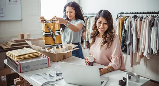 Two online sellers preparing to ship USPS packages.